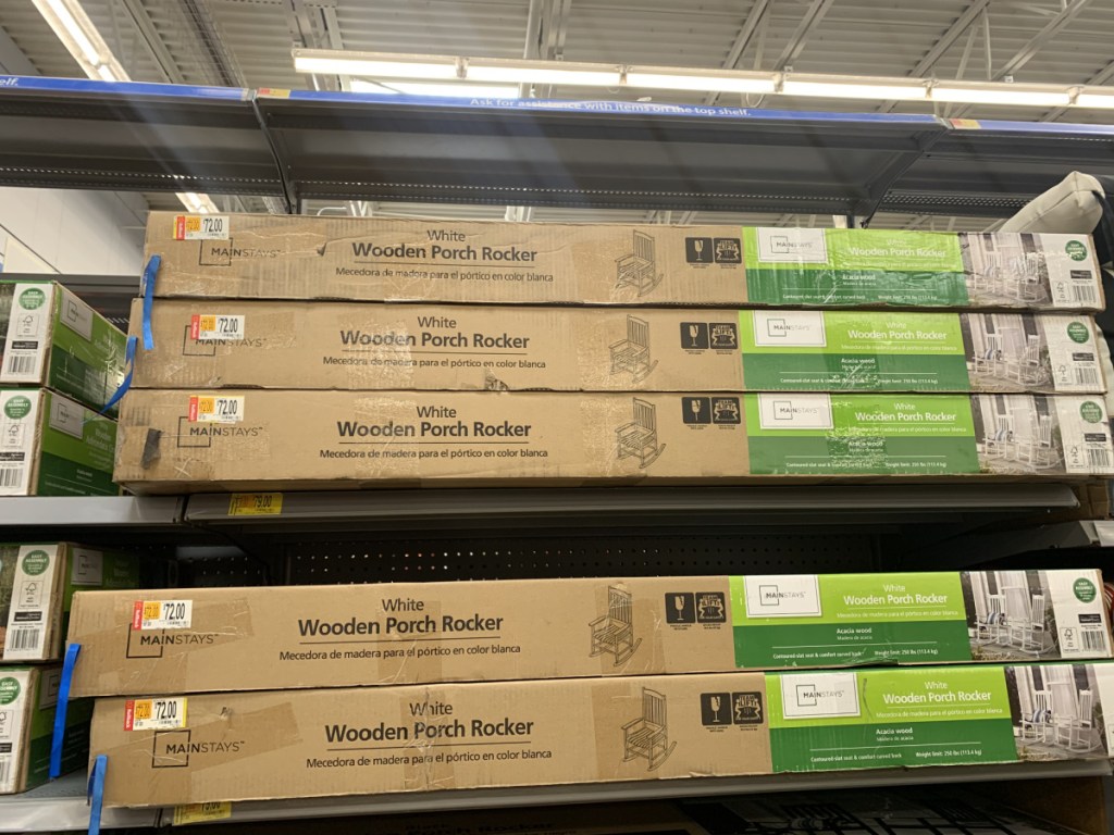 store shelf with boxes of wooden chairs
