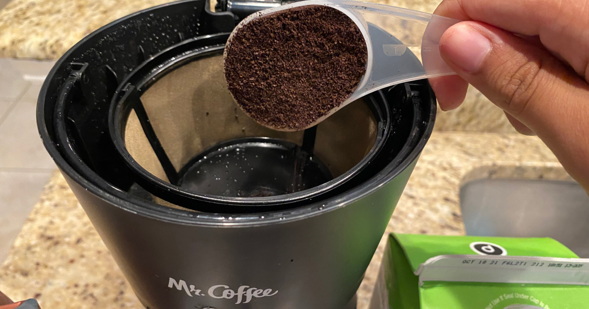 ground coffee into machine