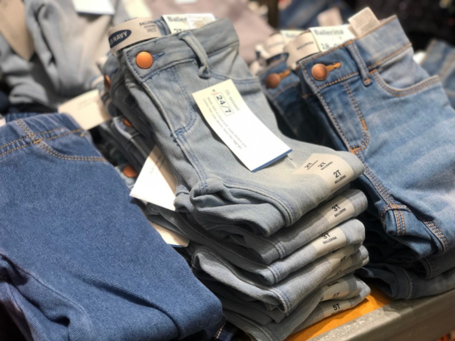 old navy girls toddler jeans folded on display in store