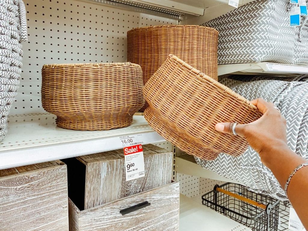 hand taking woven basket off Target shelf
