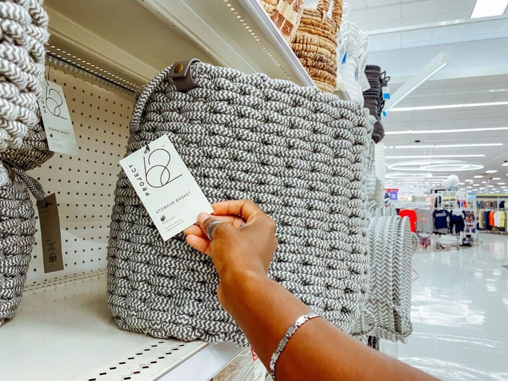 woman holding tag from Project 62 gray woven basket
