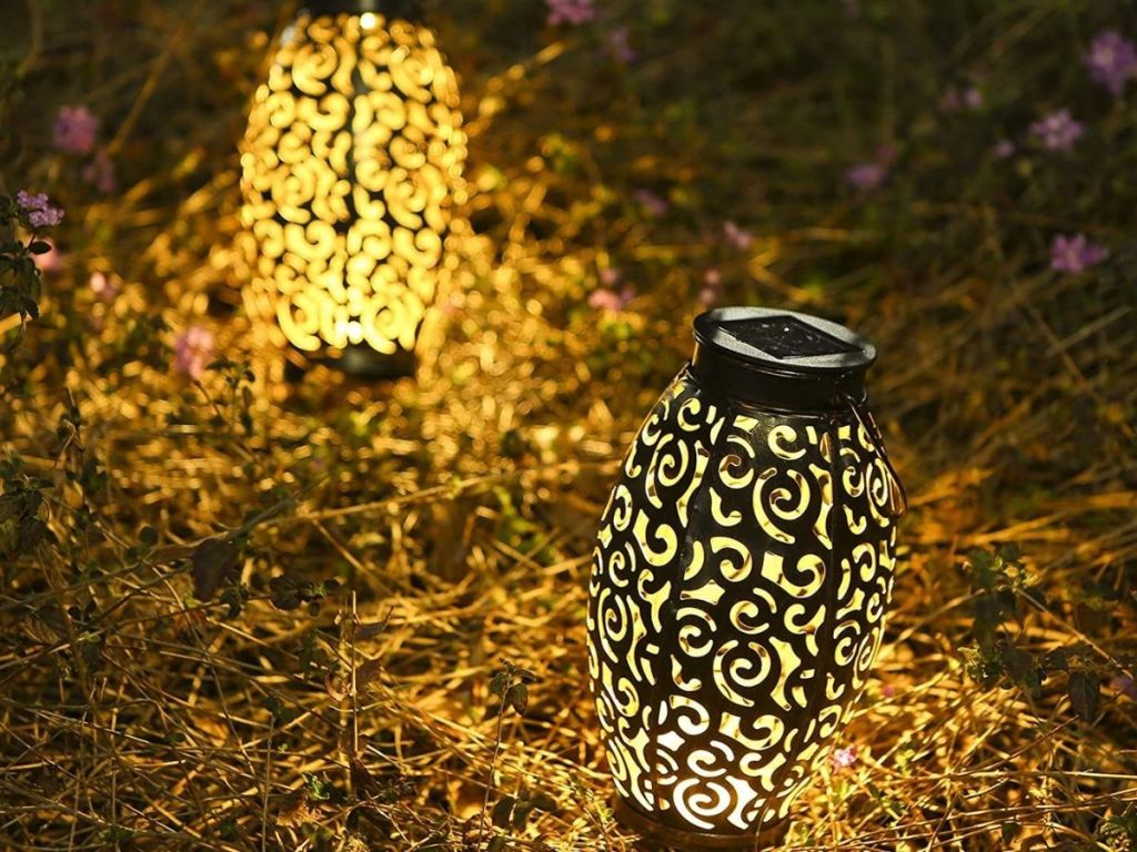 patterned lantern on grass at night