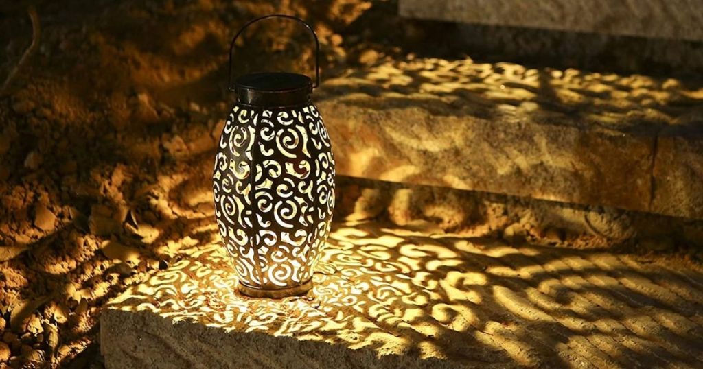 patterned lantern on steps at night