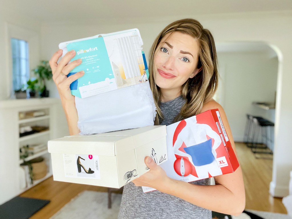 woman holding up target products with sad face