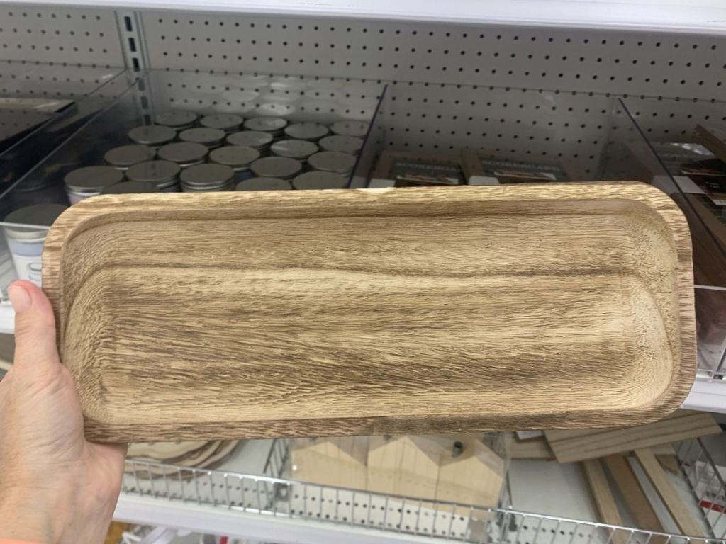 hand holding wood trays
