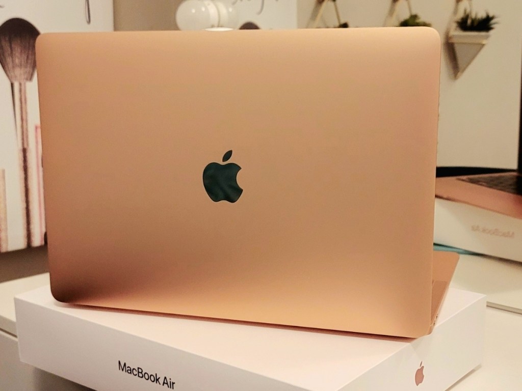 gold macbook air laptop on box