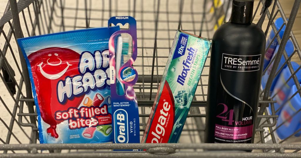 candy, shampoo, toothpaste and toothbrushes in basket