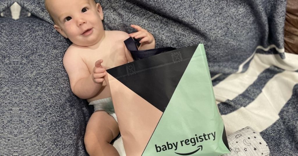 bbay holding on to Amazon Baby Registry bag