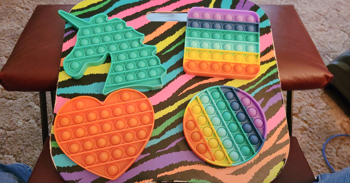 Push Pop Pop Bubble Fidget Sensory Toys on zebra stripe surface