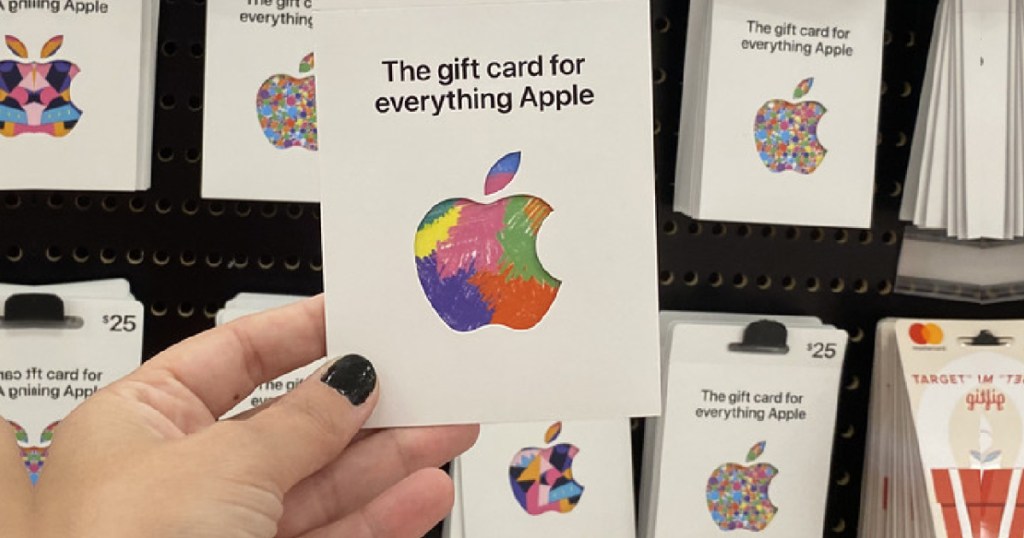 hand holding an apple gift card