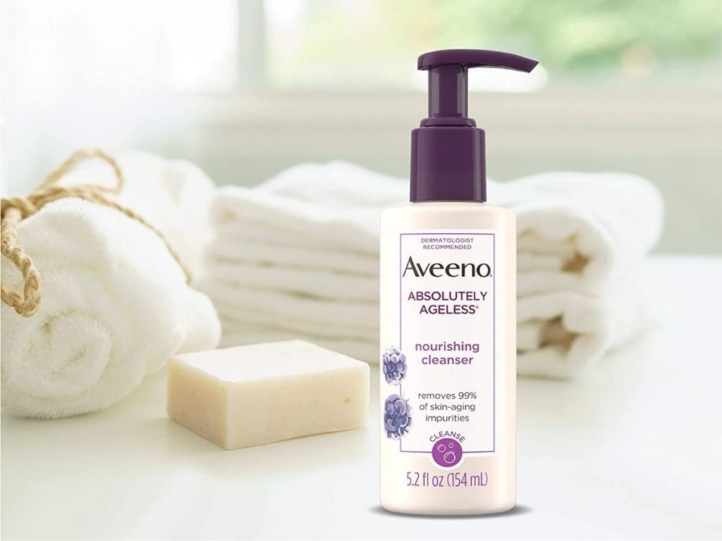 Aveeno absolutely ageless bottle on counter