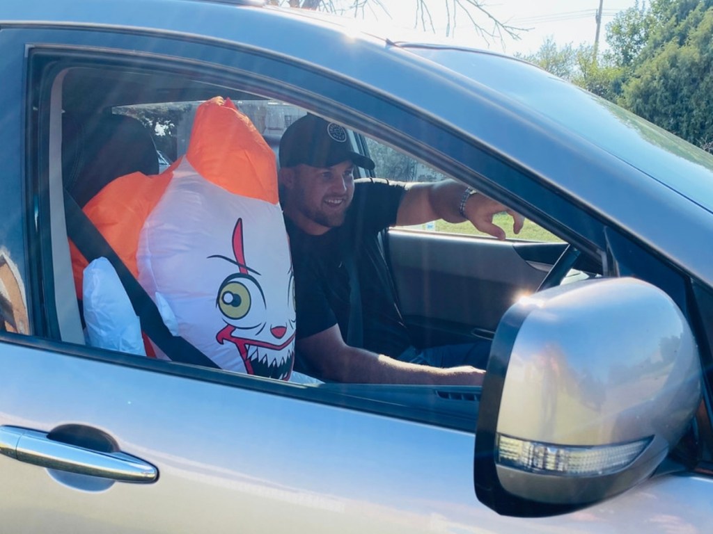 man in car with inflatable Pennywise Clown (1)