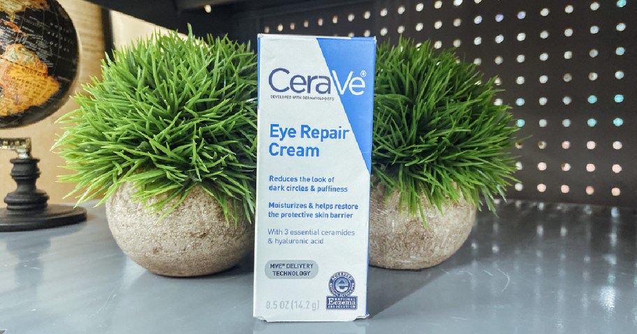 CeraVe Eye Repair Cream box on shelf in front of plants