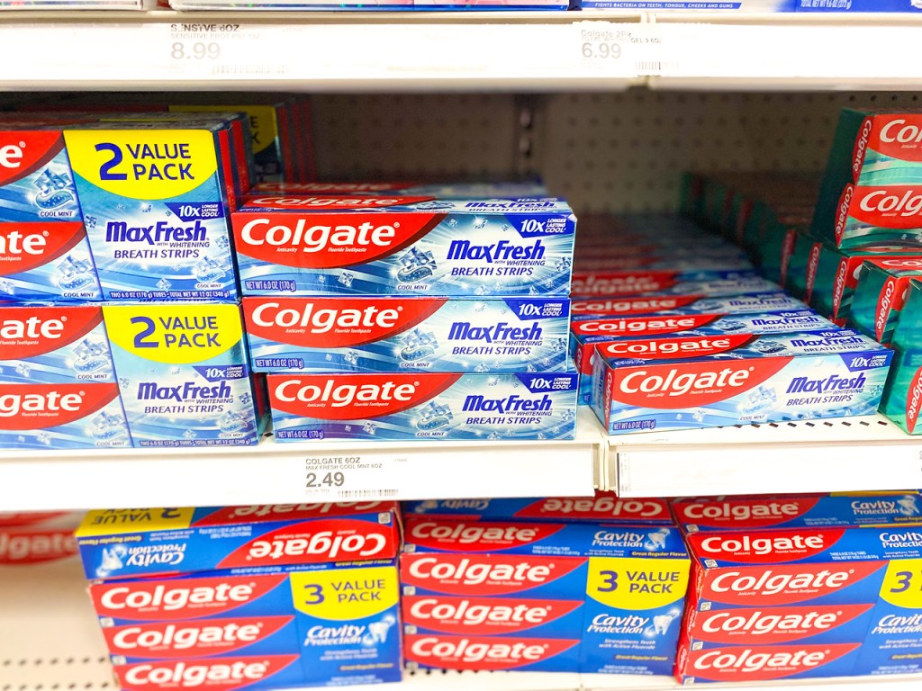 Colgate MaxFresh Toothpastes stacked on store shelf