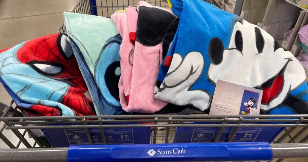 Disney 100 Towels in the front basket of Sam's Club shopping cart