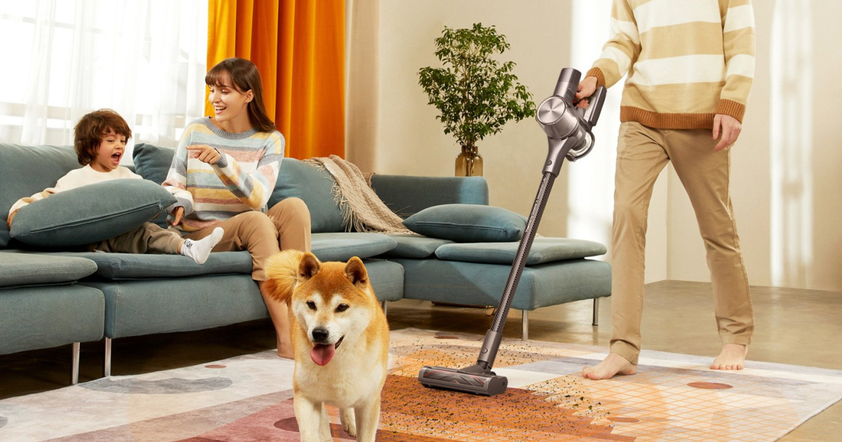 family with cordless vacuum