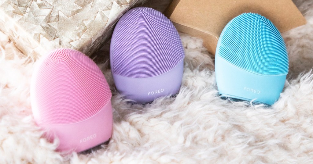 pink, purple, and blue foreo facial brushes