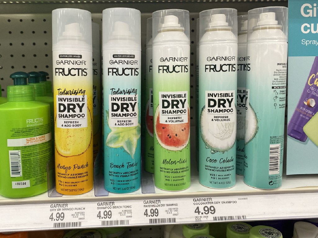 cans of dry shampoo on store shelf