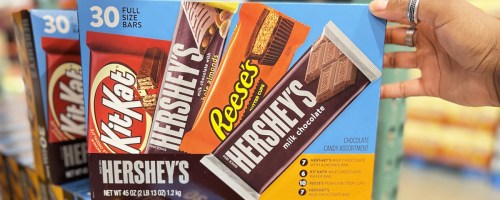 hand holding box of hershey's candy bars