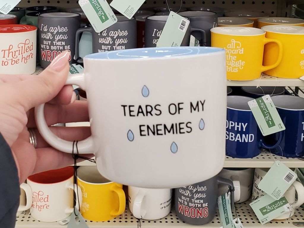 hand holding a Hobby Lobby coffee mug that says Tears of My enemies