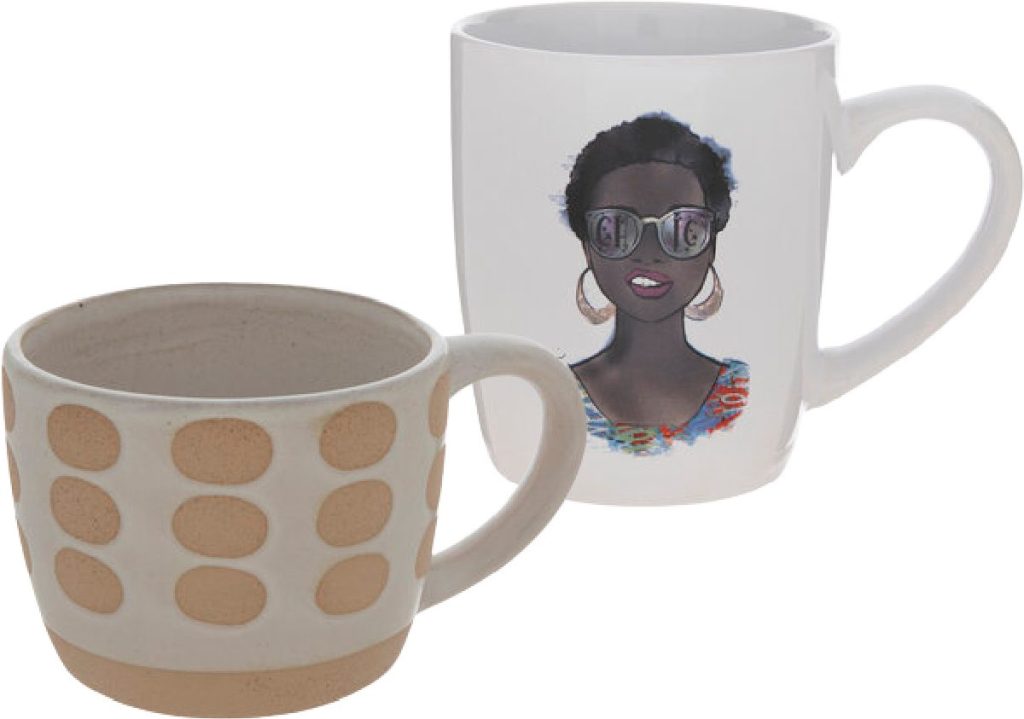 two Hobby Lobby Mugs, one with beige dots and the other with a woman wearing sunglasses