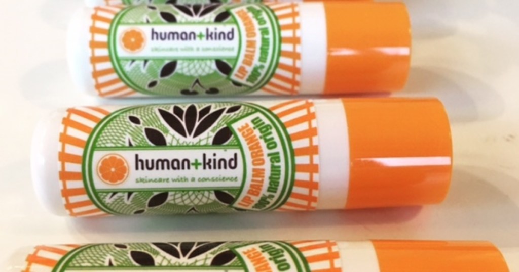 human + kind orange lip balms in a row