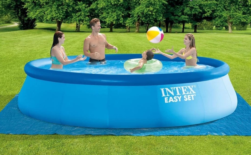 Family playing in a swimming pool