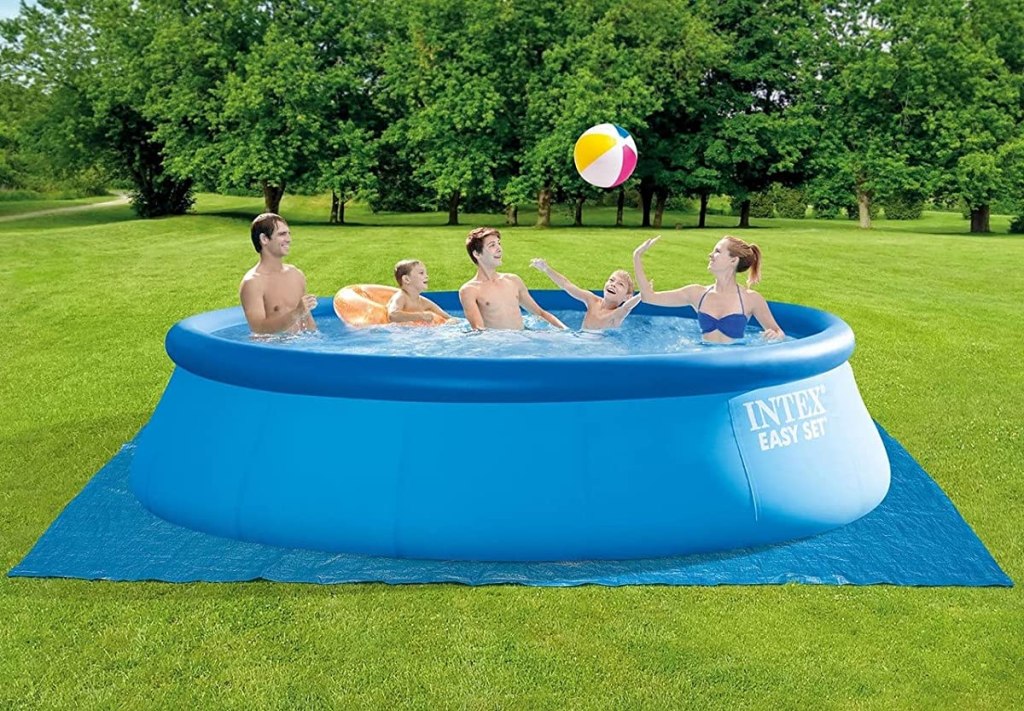 Family playing in a large pool