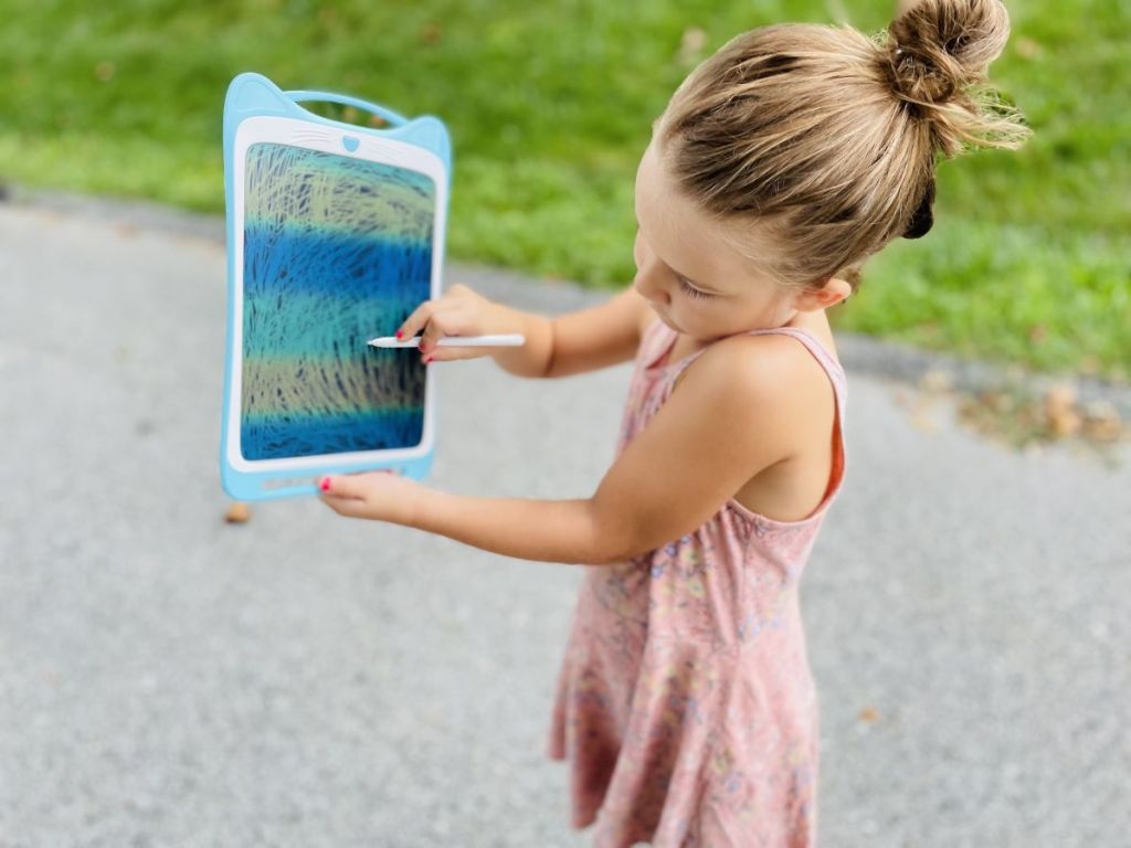 girl holding a doodle board