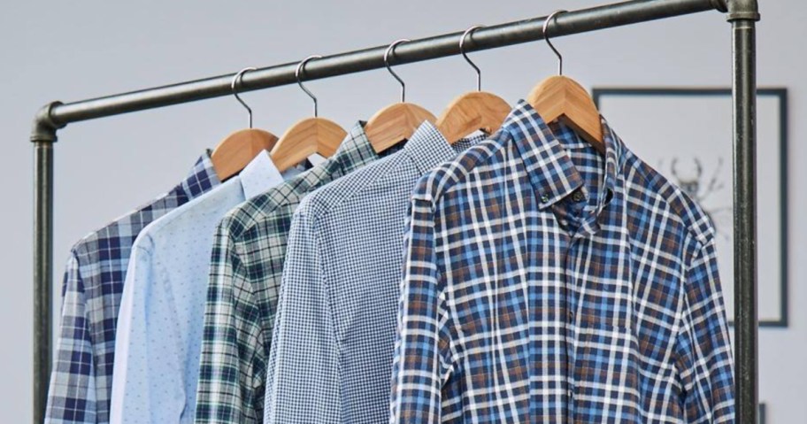 men's dress shirts hanging on a rack