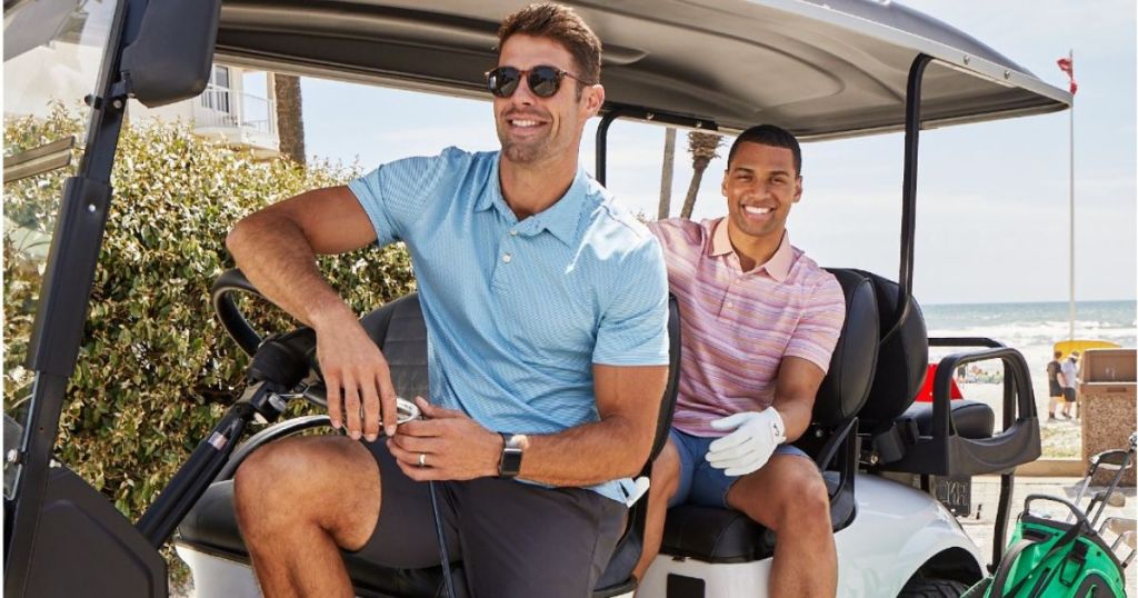 Two men riding in a golf cart wearing Jos. A Bank Clothing