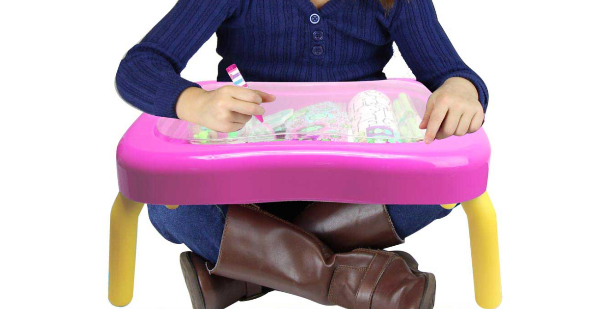 kid sitting with an activity desk