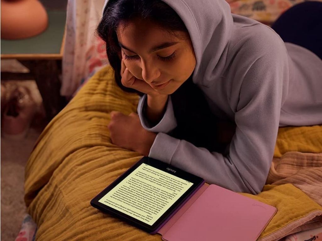 girl reading from a kindle tablet