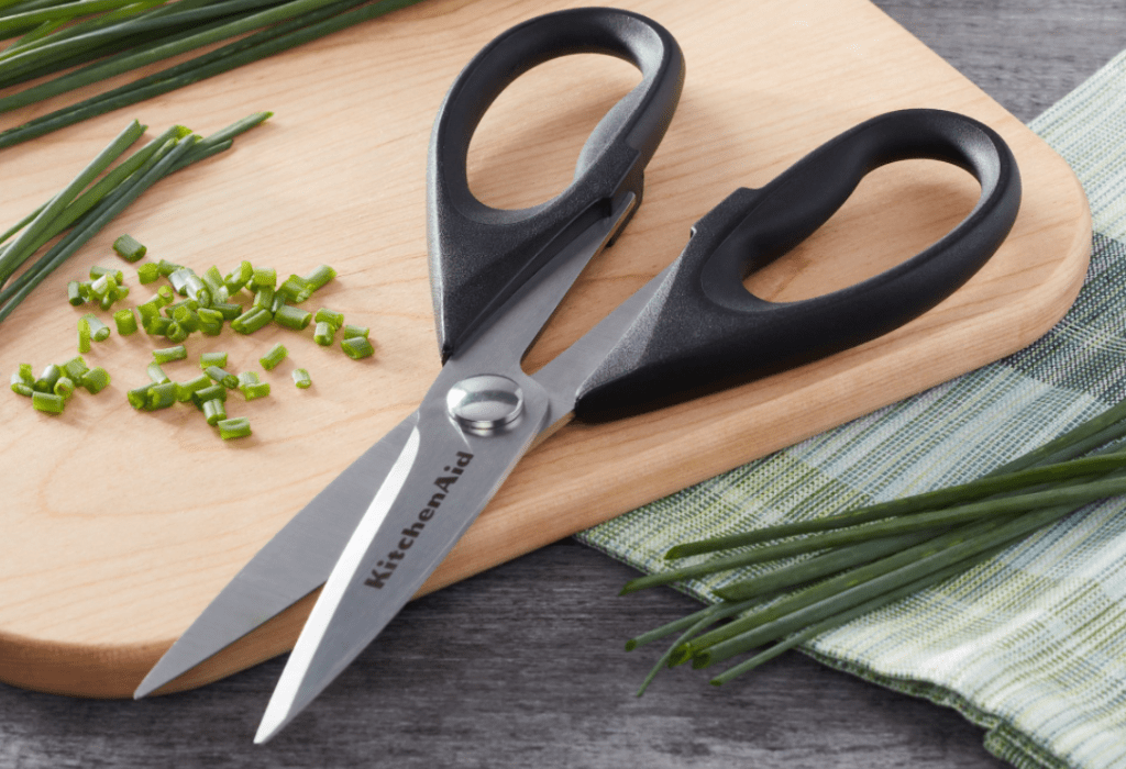 scissors on a cutting board