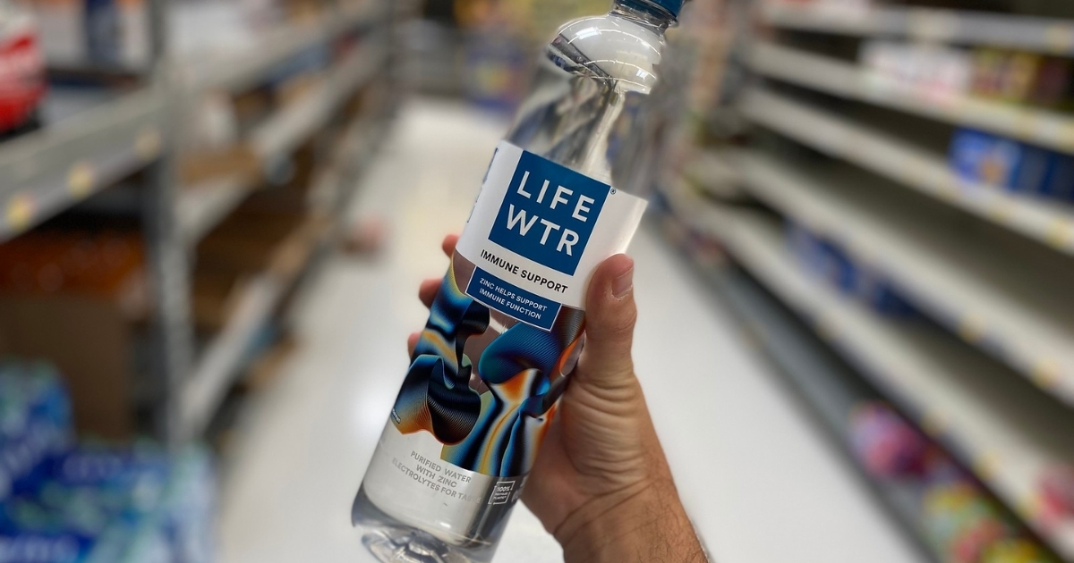 hand holding lifewtr immune support in store