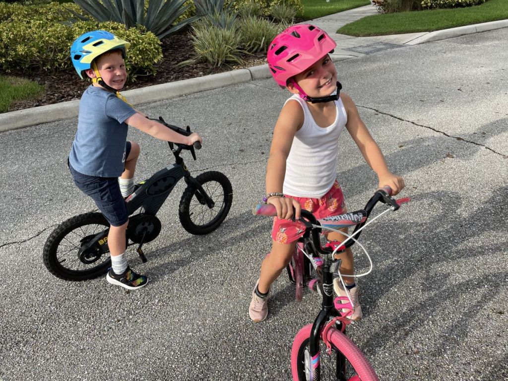 two kids on bikes