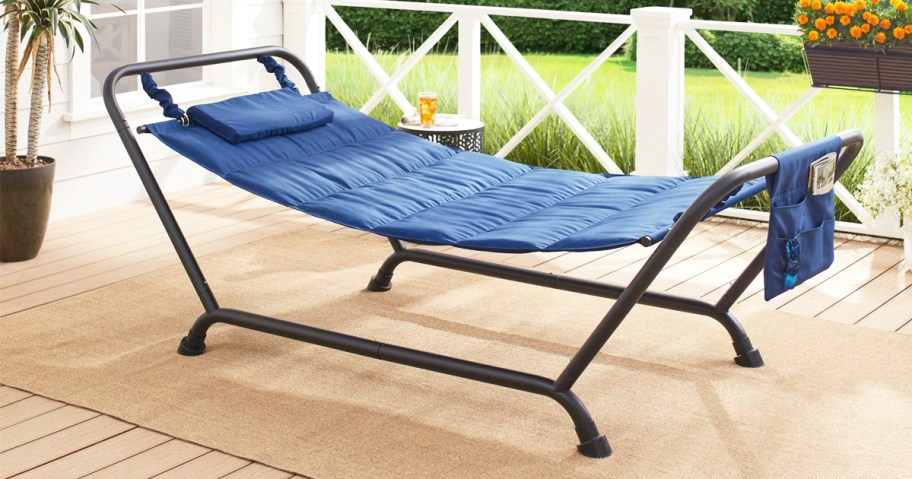 blue quilted hammock on stand