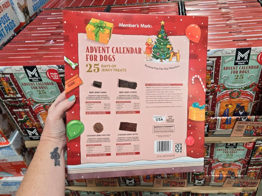 Member's Mark Jerky Treat Advent Calendar for Dogs in hand in store showing the back of the box