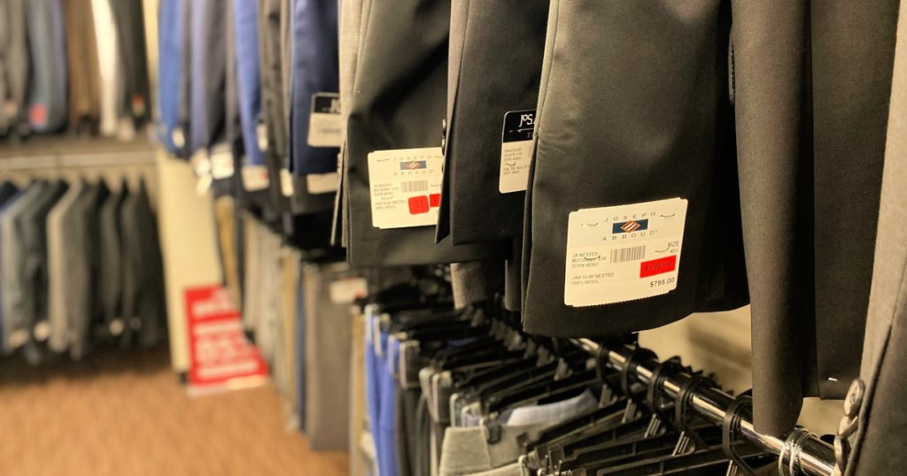 Men's Wearhouse suits on clearance rack