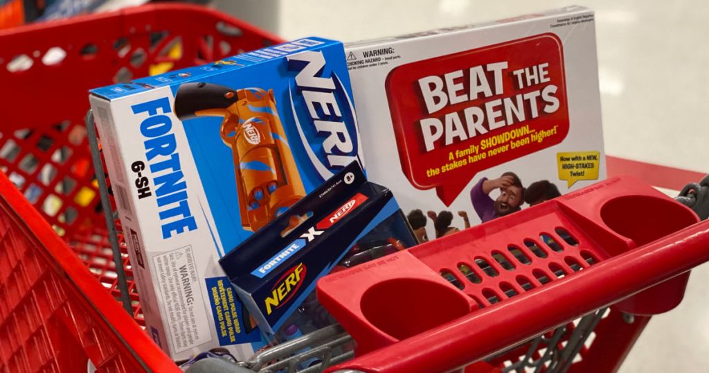 toy gun and board game in red basket 