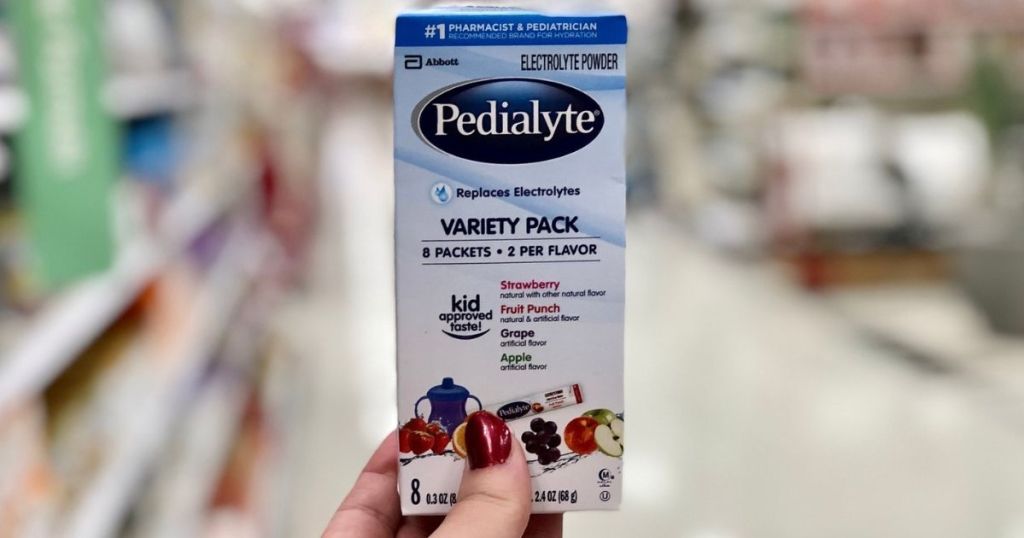 hand holding Pedialyte powder pack