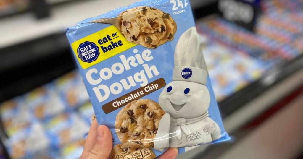 hand holding a package of Pillsbury cookie dough