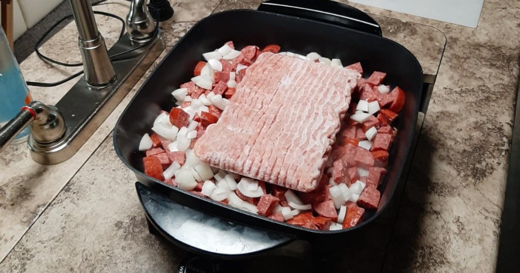 skillet on counter with meat and veges in it