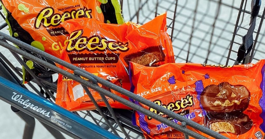 three bags of Reese's Peanut Butter cups in a cart