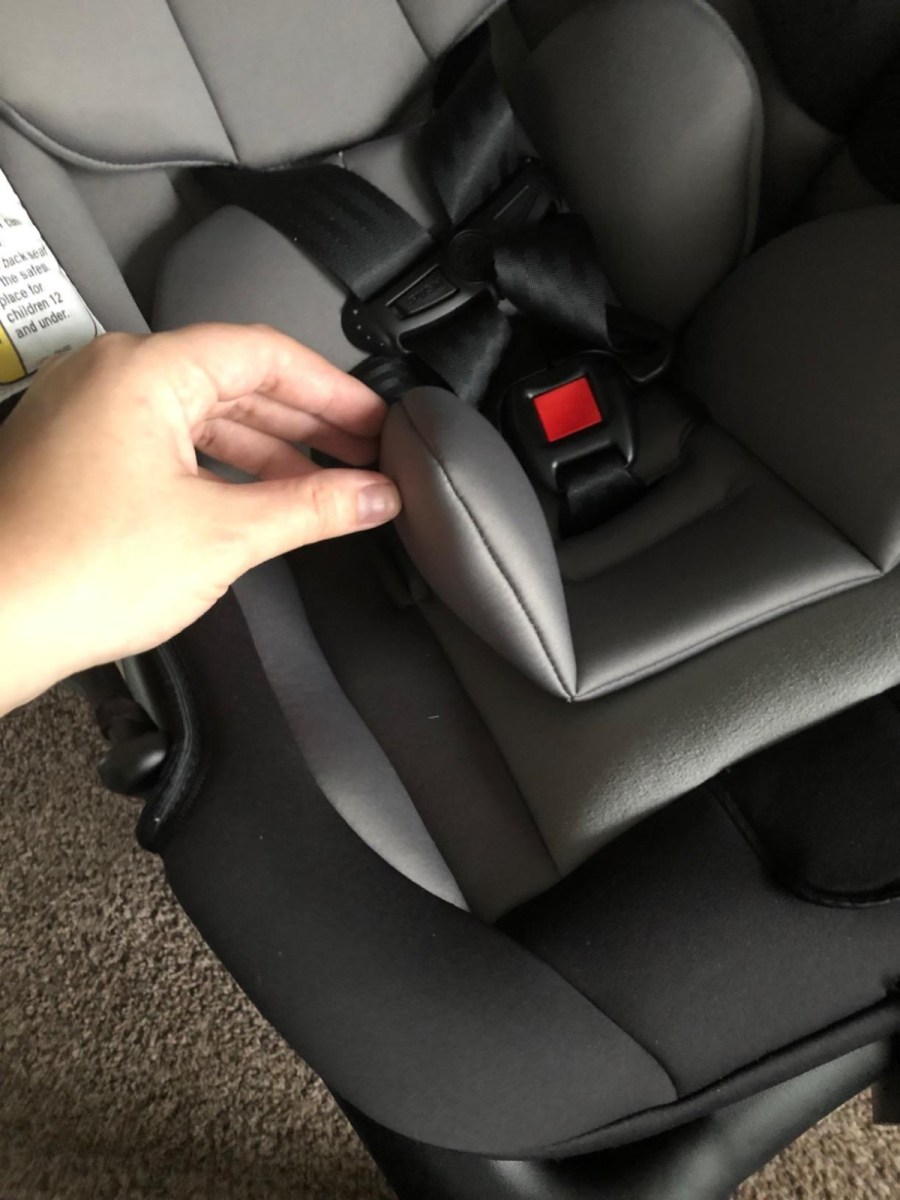 hand showing the insert of a safety first infant car seat