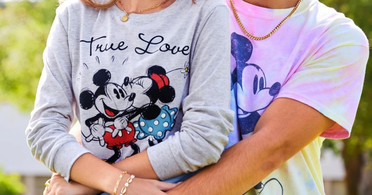 woman and man wearing mickey and minnie tshirts from disney