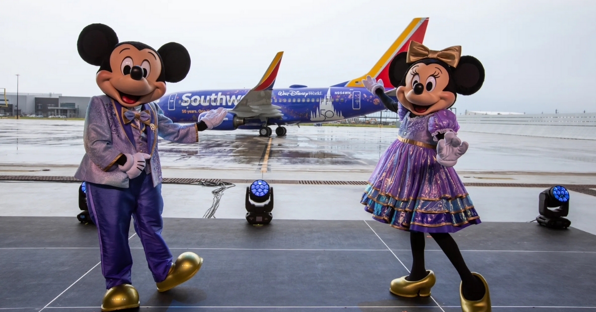 Mickey and Minnie Mouse with Disney Southwest plane