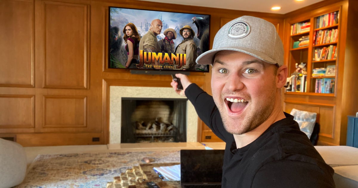 man very excited to watch Jumanji on his TV