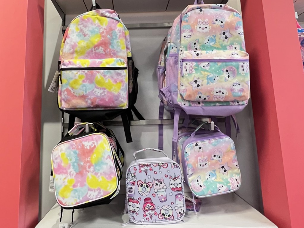matching backpacks and lunchboxes on display in store