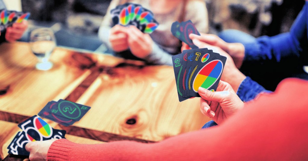family at table playing uno